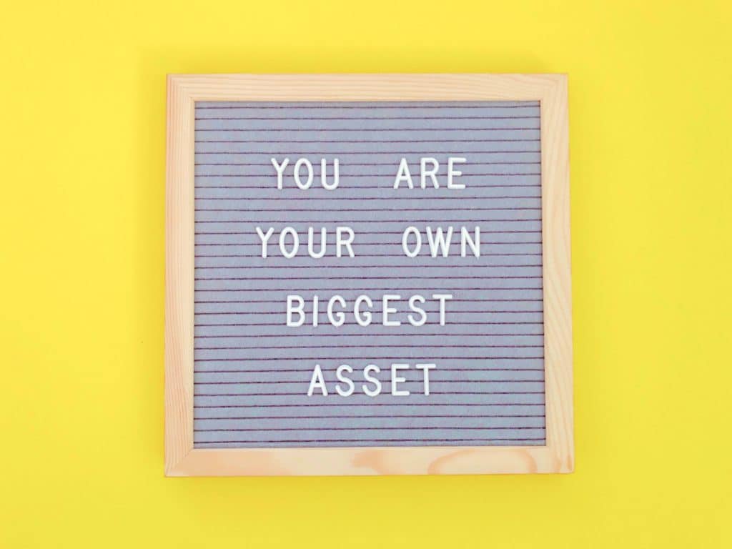 board with the quote “you are your own biggest asset”